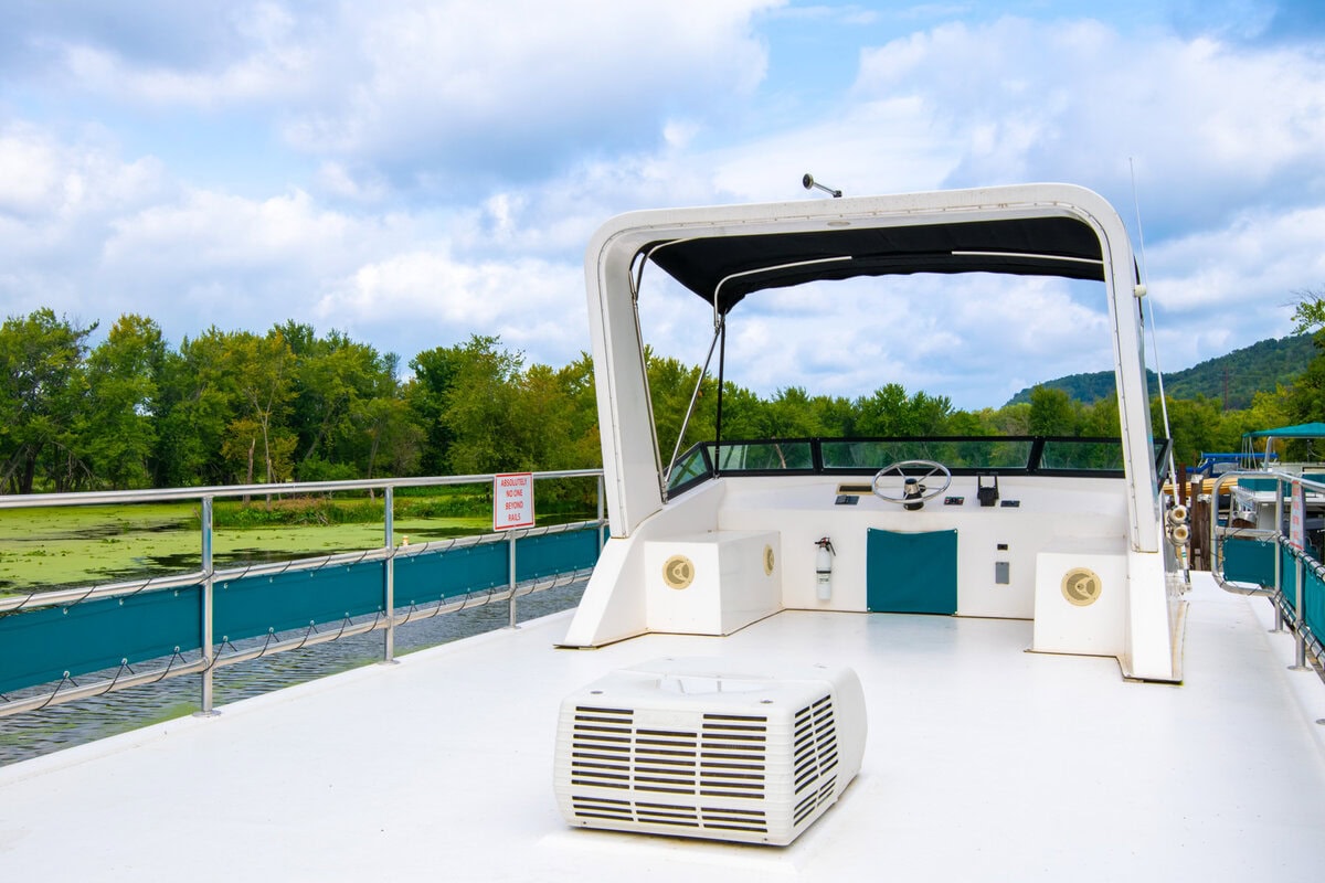 Great River Harbor_Fun n the Sun Houseboats-09 Boat deck with scenic river backdrop in Buffalo County Wisconsin, popular for outdoor recreation and sightseeing.